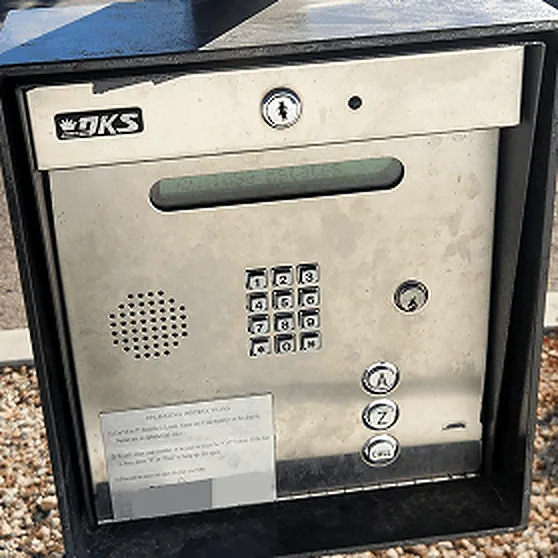 Telephone-entry call box with a keypad and directory buttons